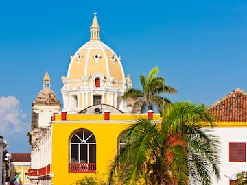a yellow building with a dome on top