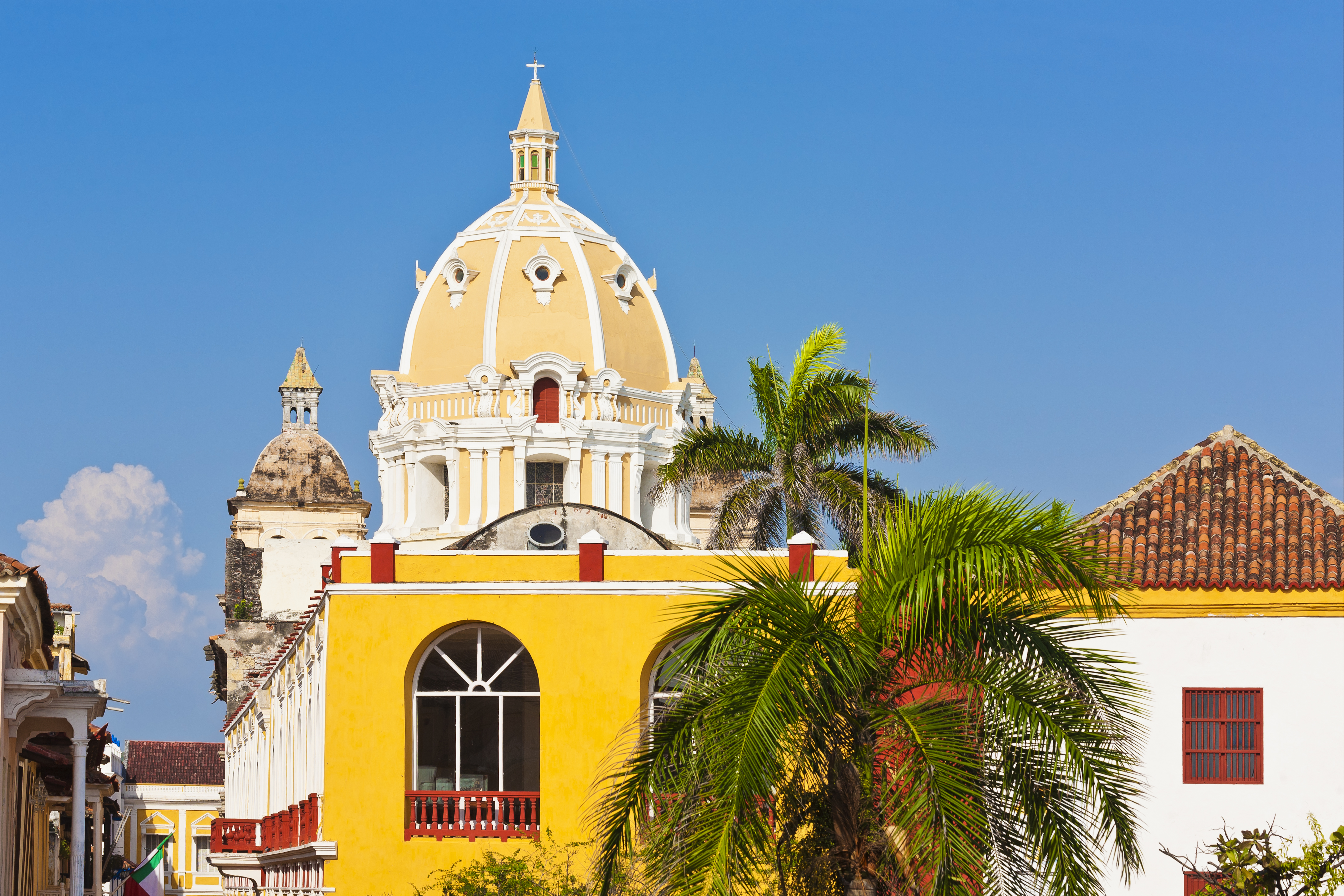 a yellow building with a dome on top