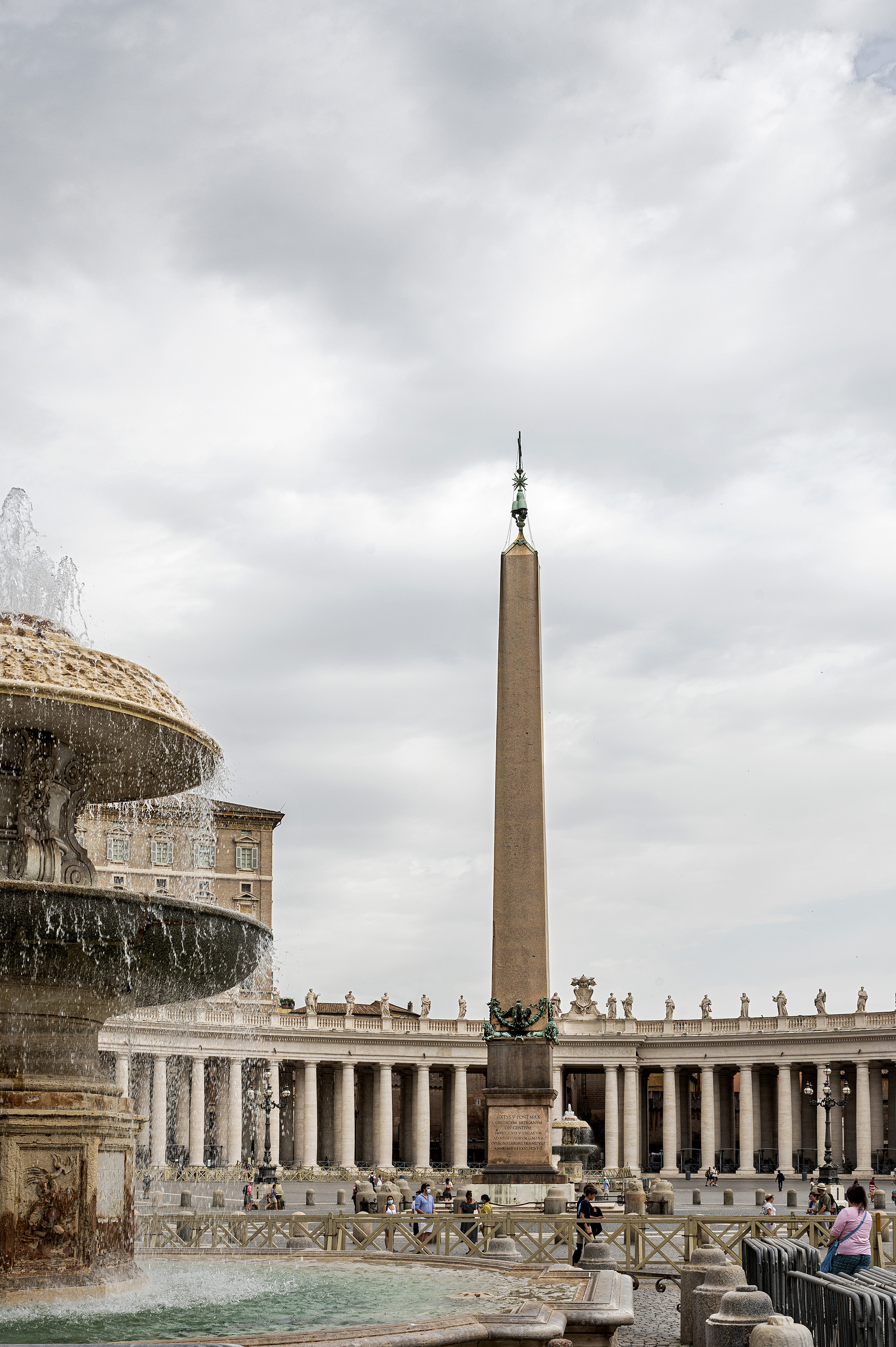 a fountain with a large obelisk in the background