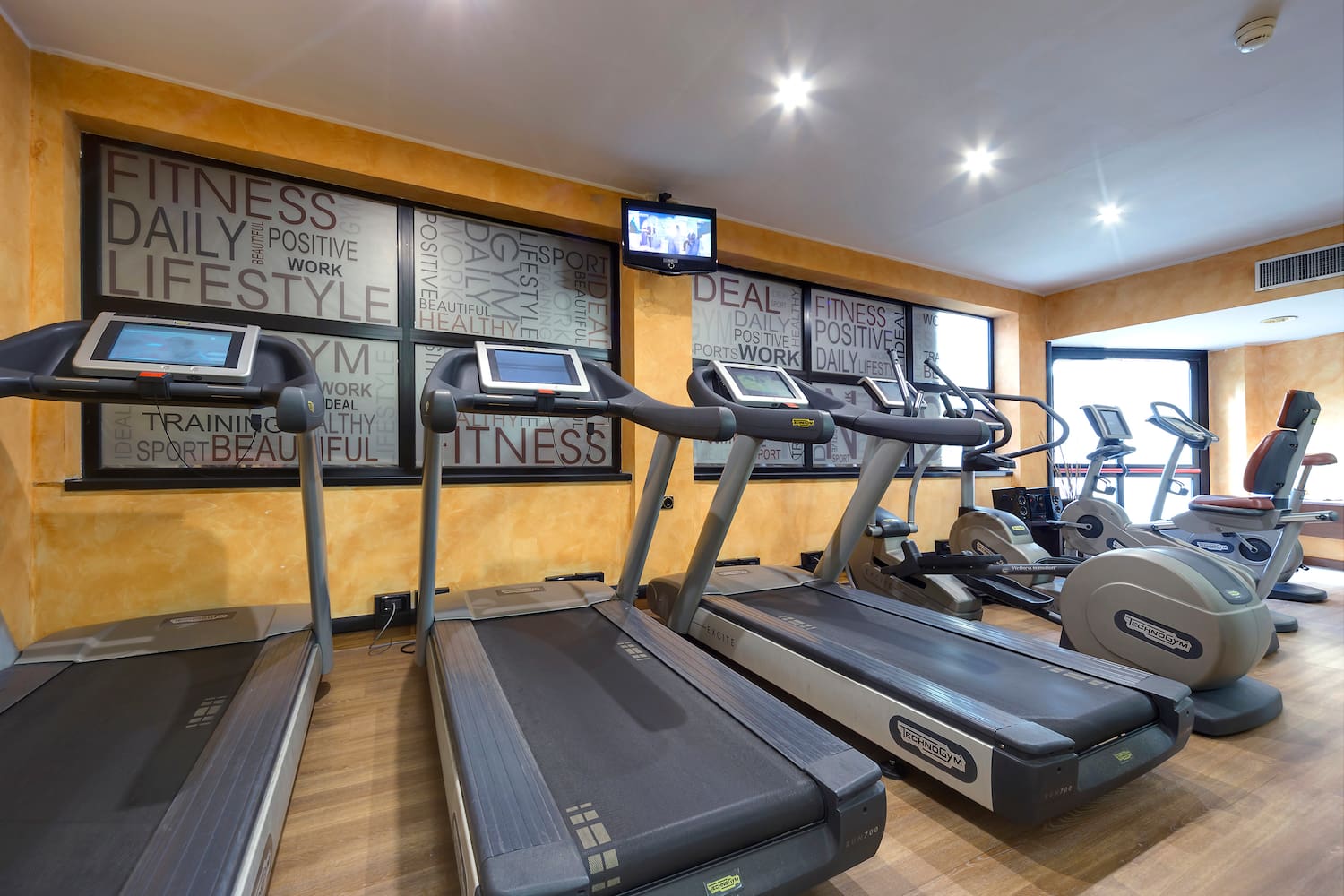 a room with treadmills and exercise machines