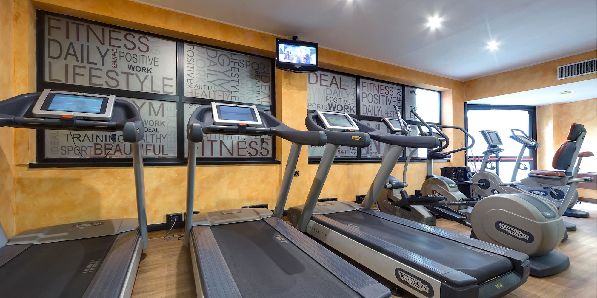 a room with treadmills and exercise machines