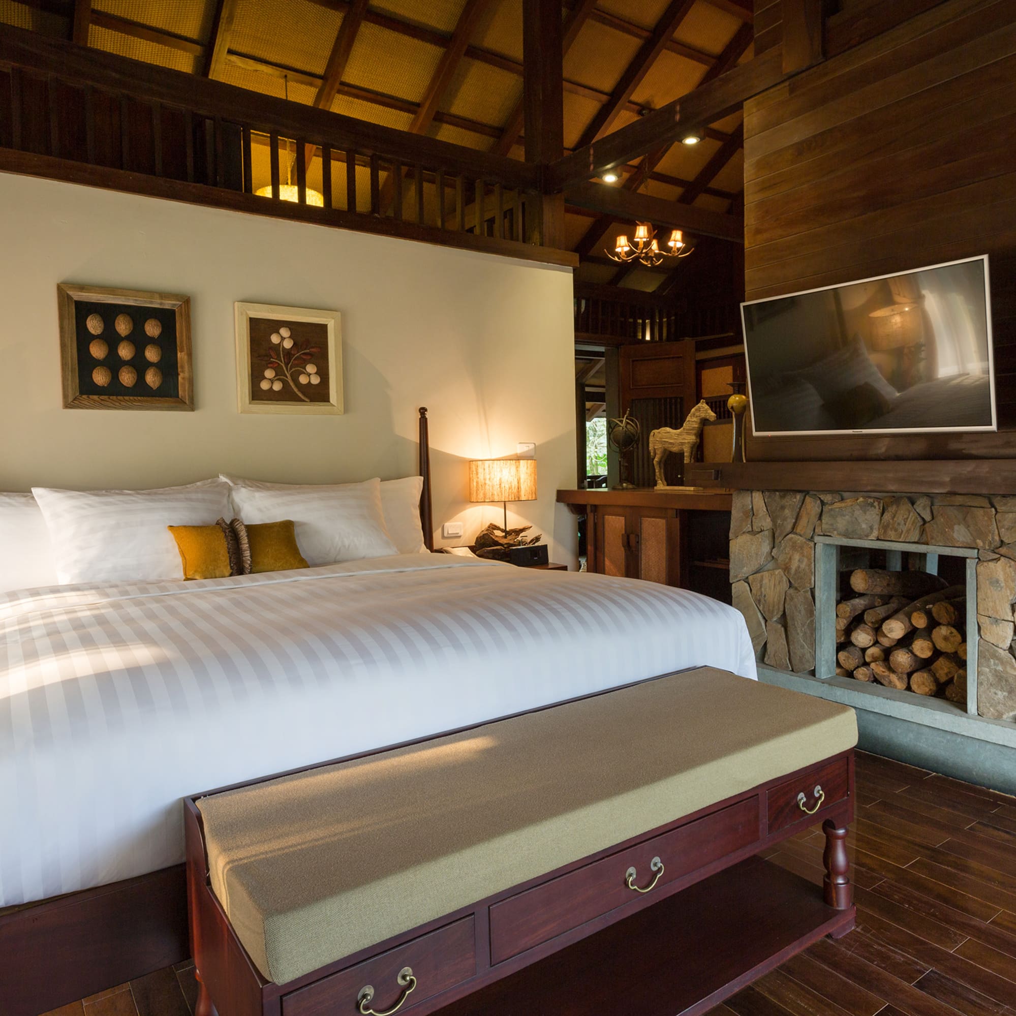 a bedroom with a fireplace and a bed