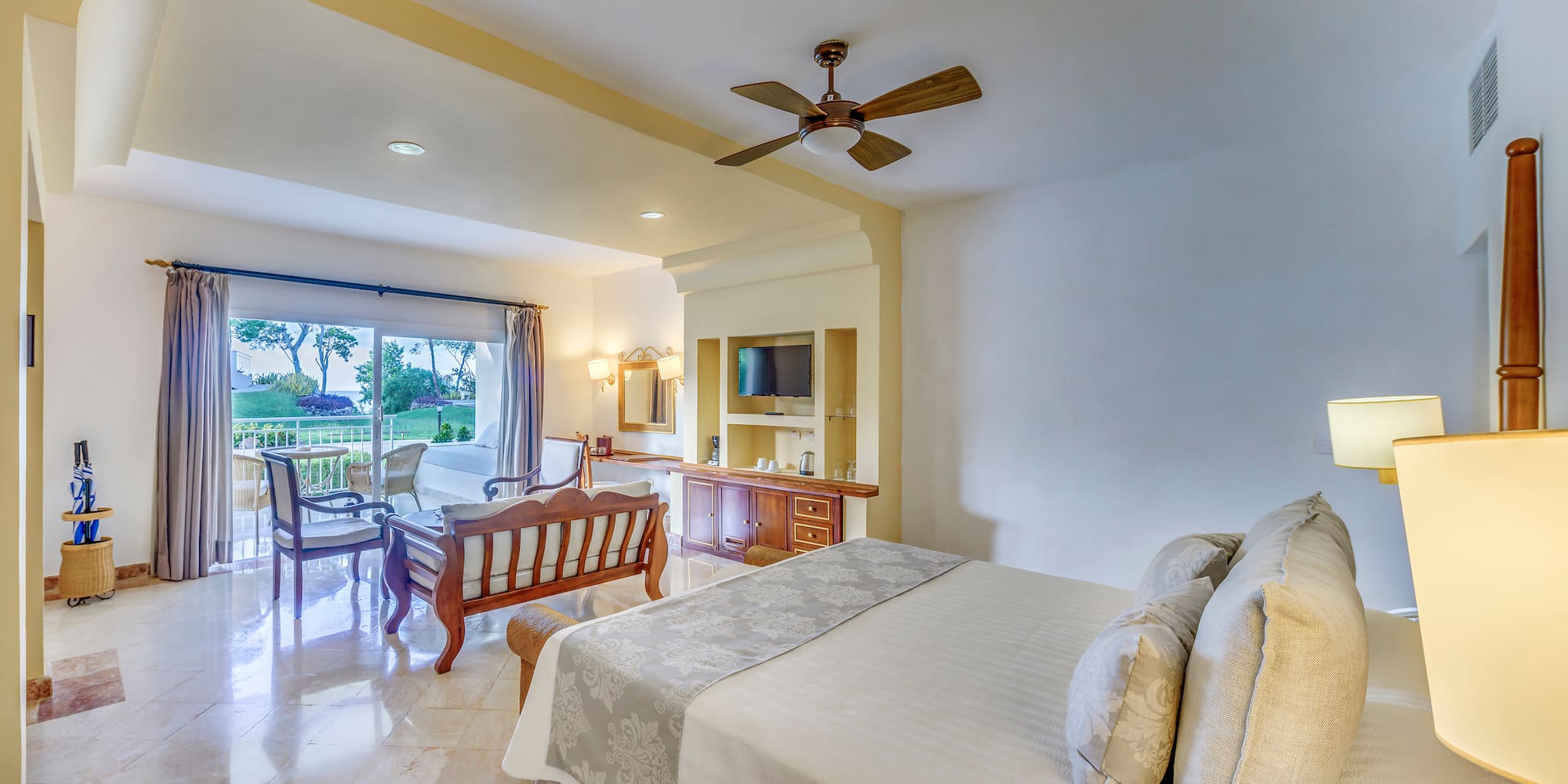 a bedroom with a bed and a television