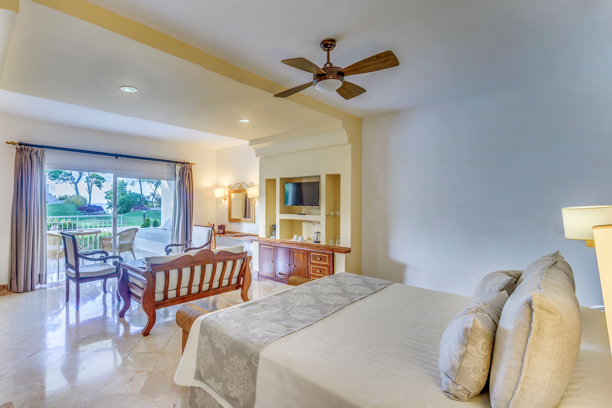 a bedroom with a bed and a television