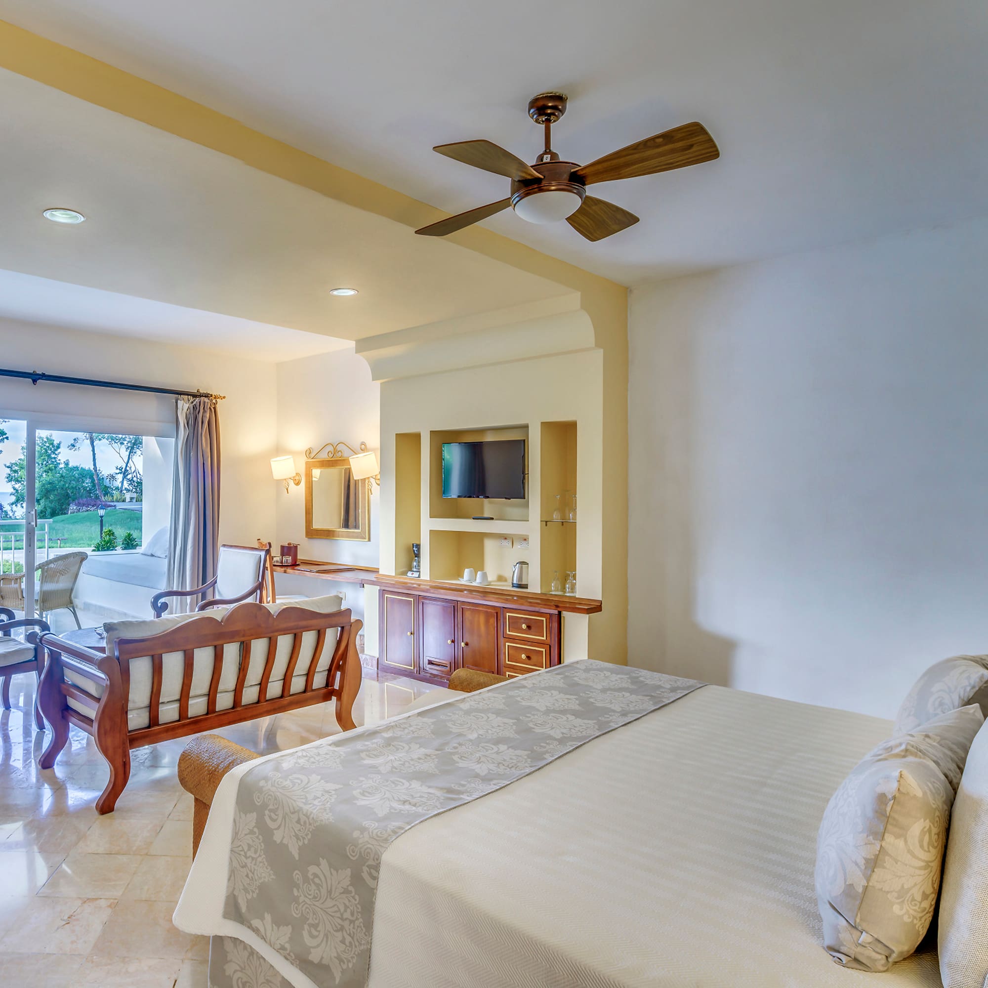 a bedroom with a bed and a television