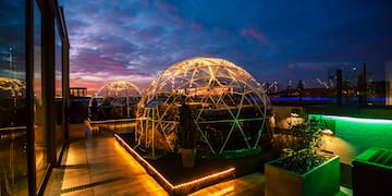 a dome shaped building with lights