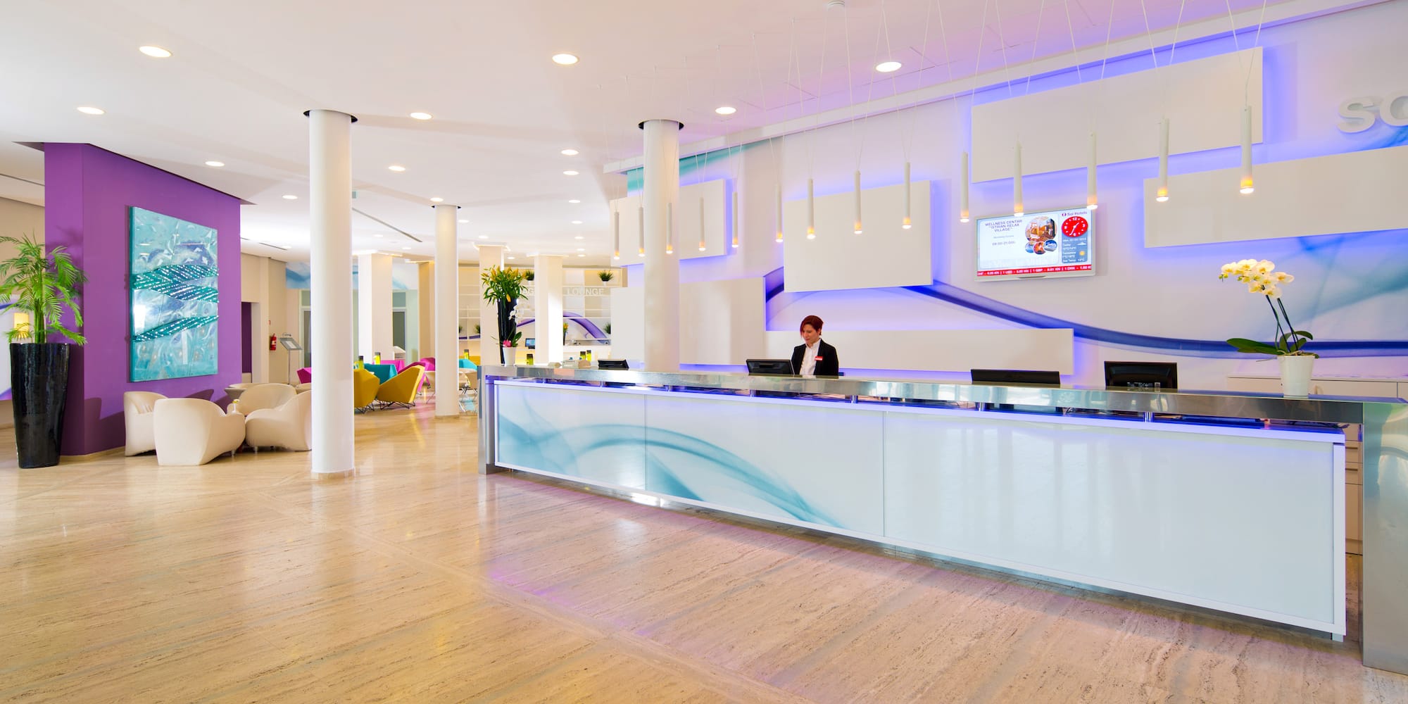 a woman standing at a reception desk