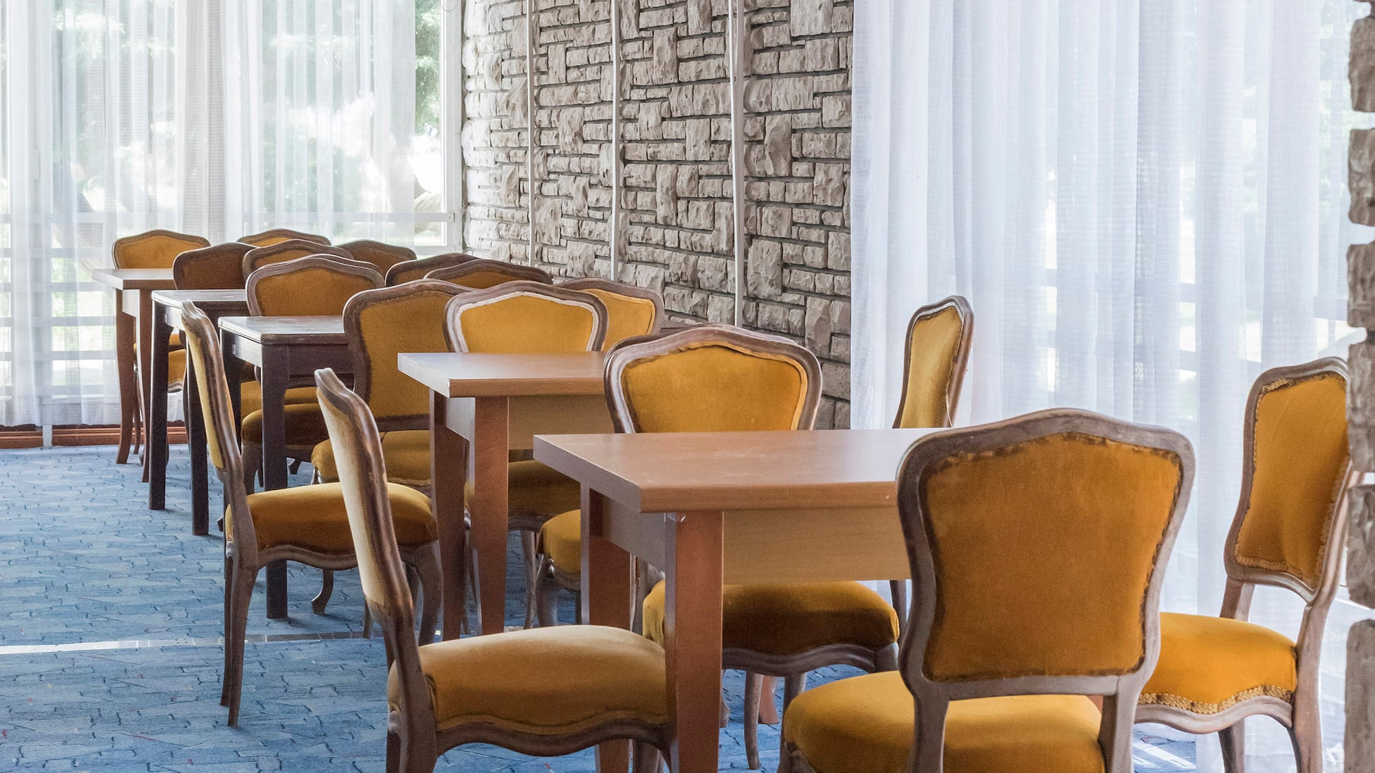 a room with tables and chairs