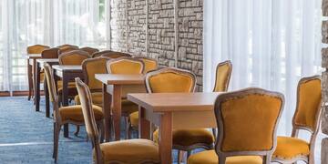 a room with tables and chairs