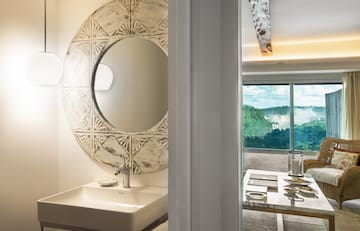 a bathroom with a mirror and sink