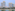 a group of tall buildings next to a body of water