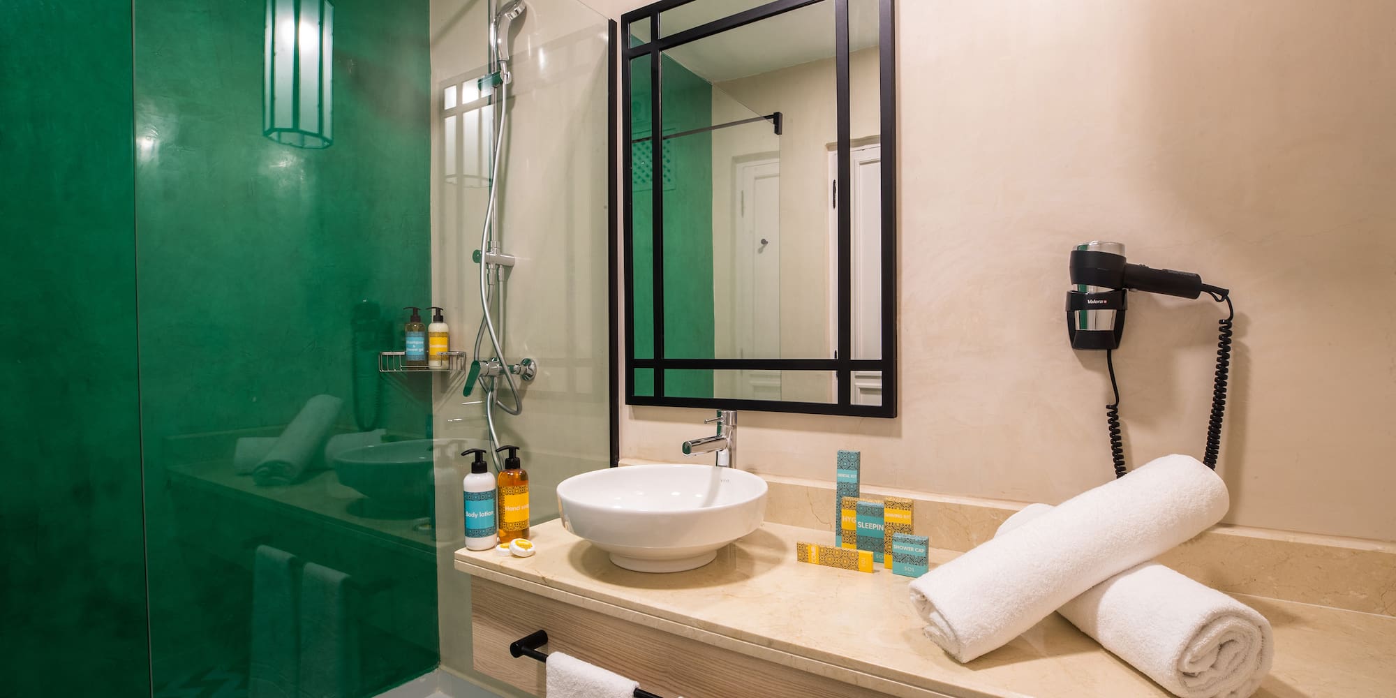 a bathroom with a sink and shower