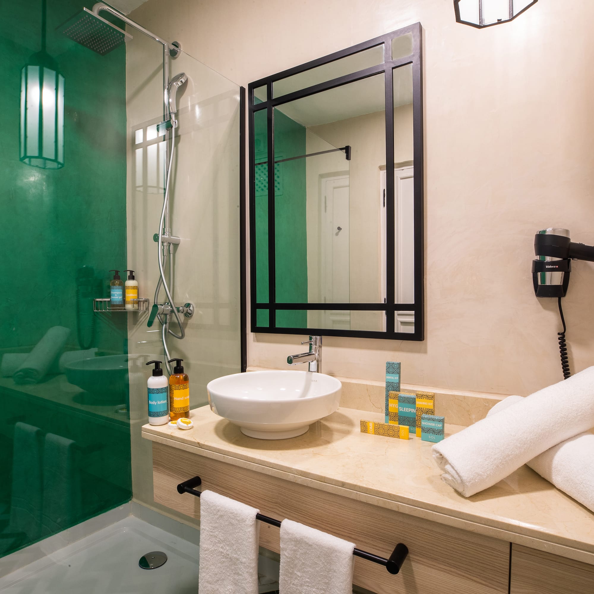 a bathroom with a sink and shower