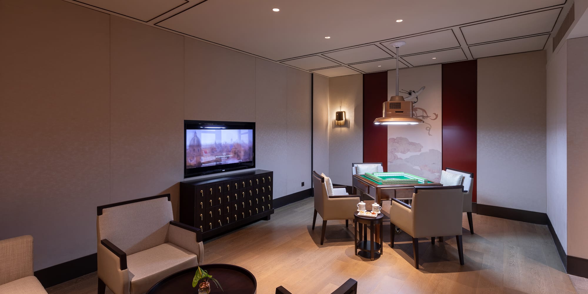 a room with a pool table and a television