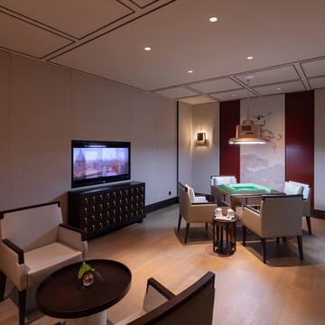 a room with a pool table and a television