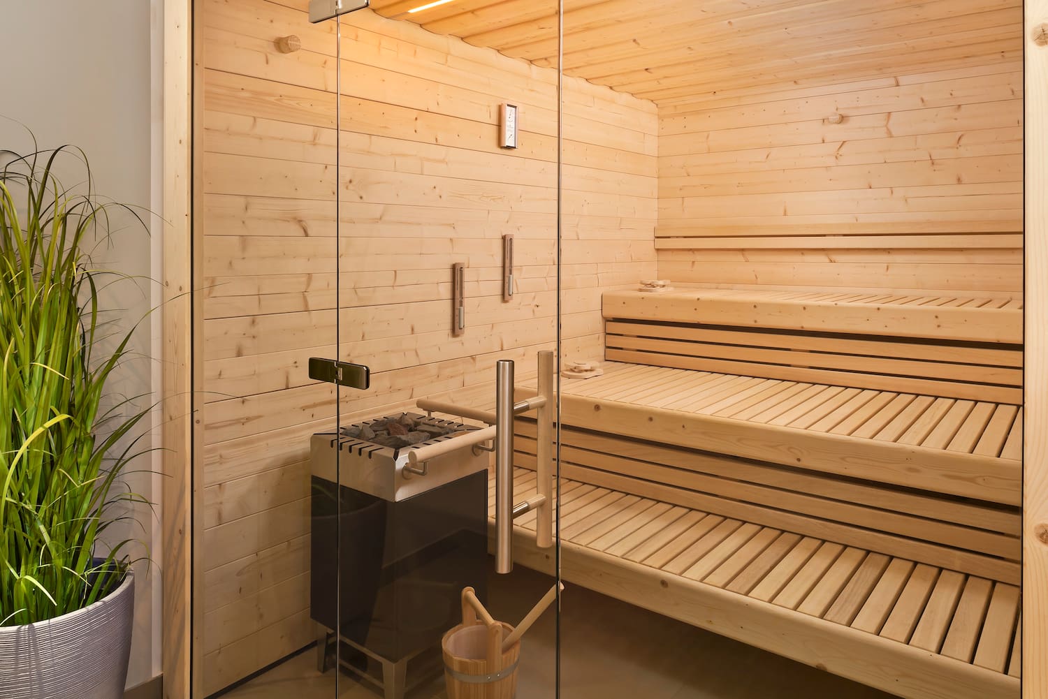 a sauna with a glass door