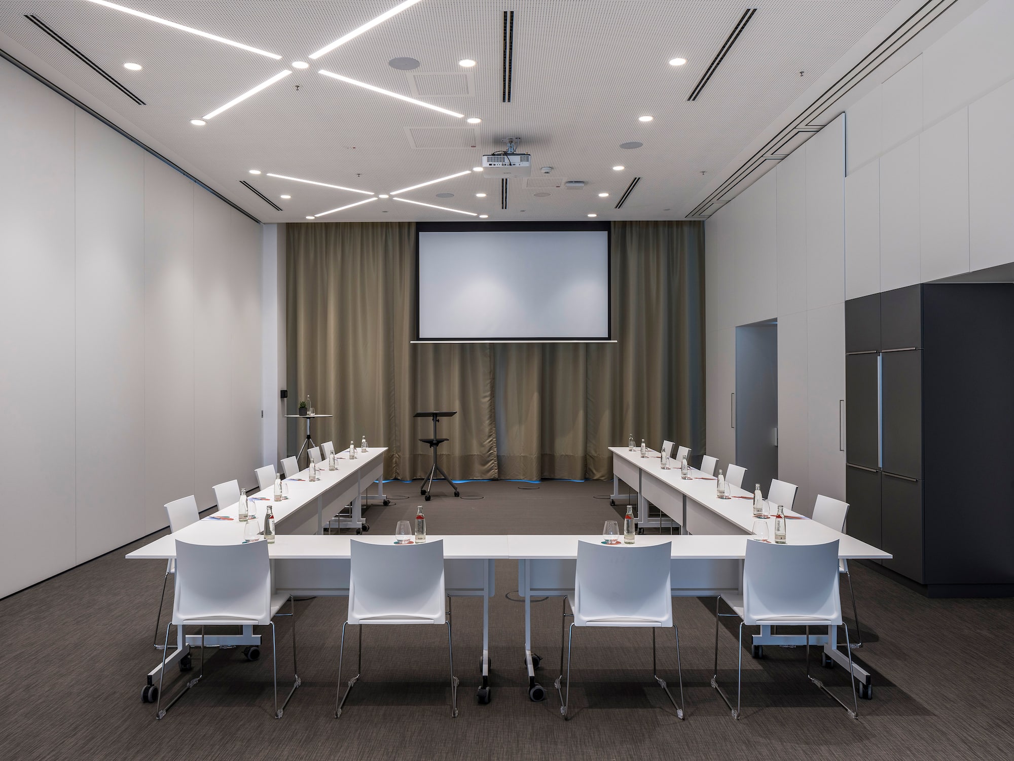 a room with a large table and chairs