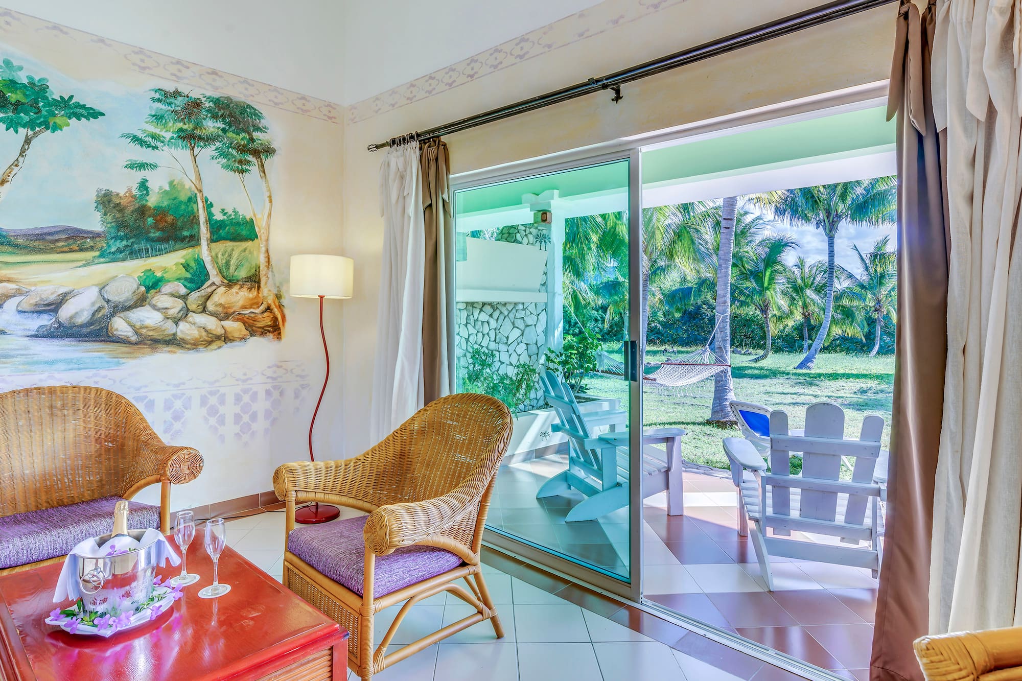 a room with a wall mural and chairs