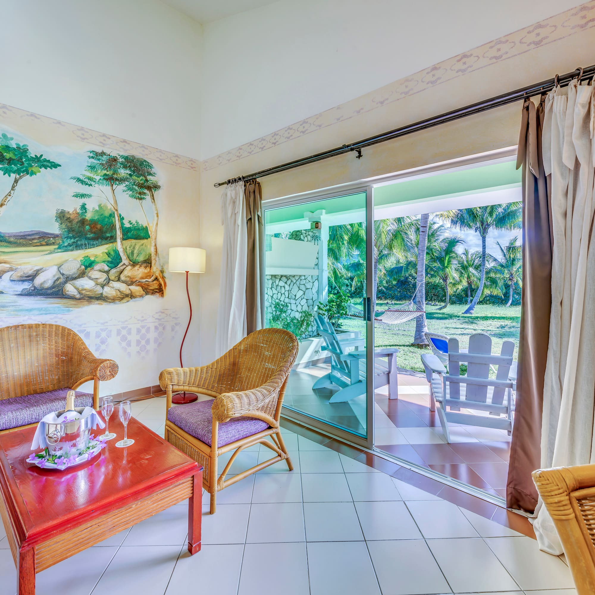 a room with a wall mural and chairs