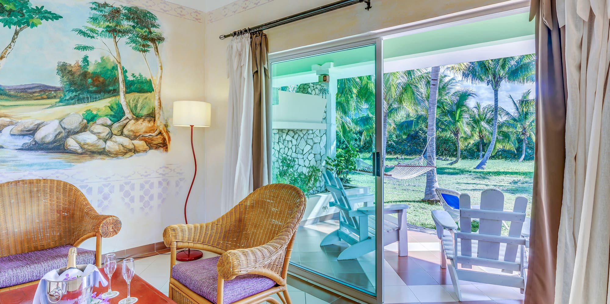 a room with a wall mural and chairs