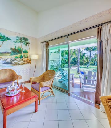 a room with a wall mural and chairs