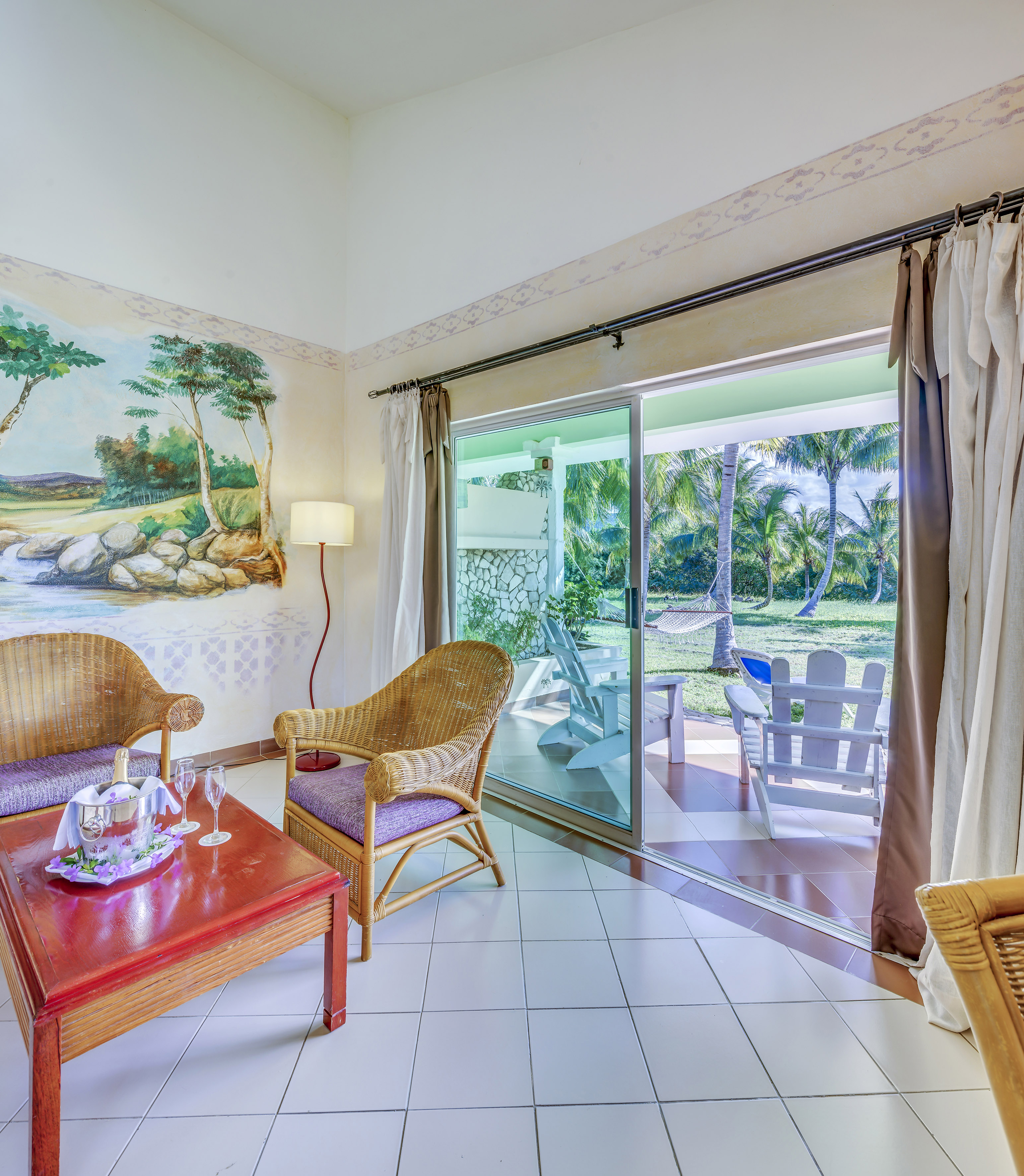 a room with a wall mural and chairs