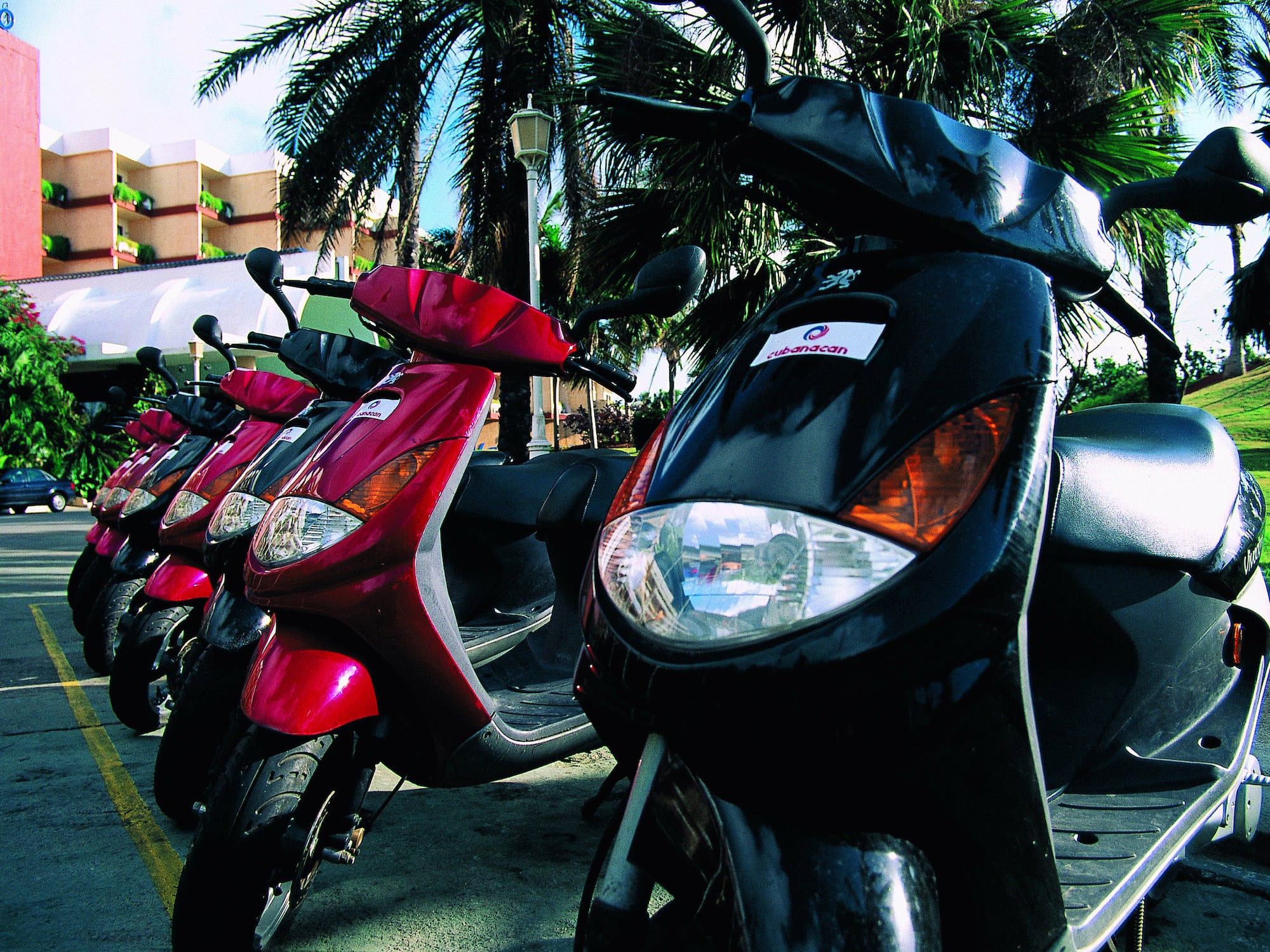 a row of scooters parked in a row