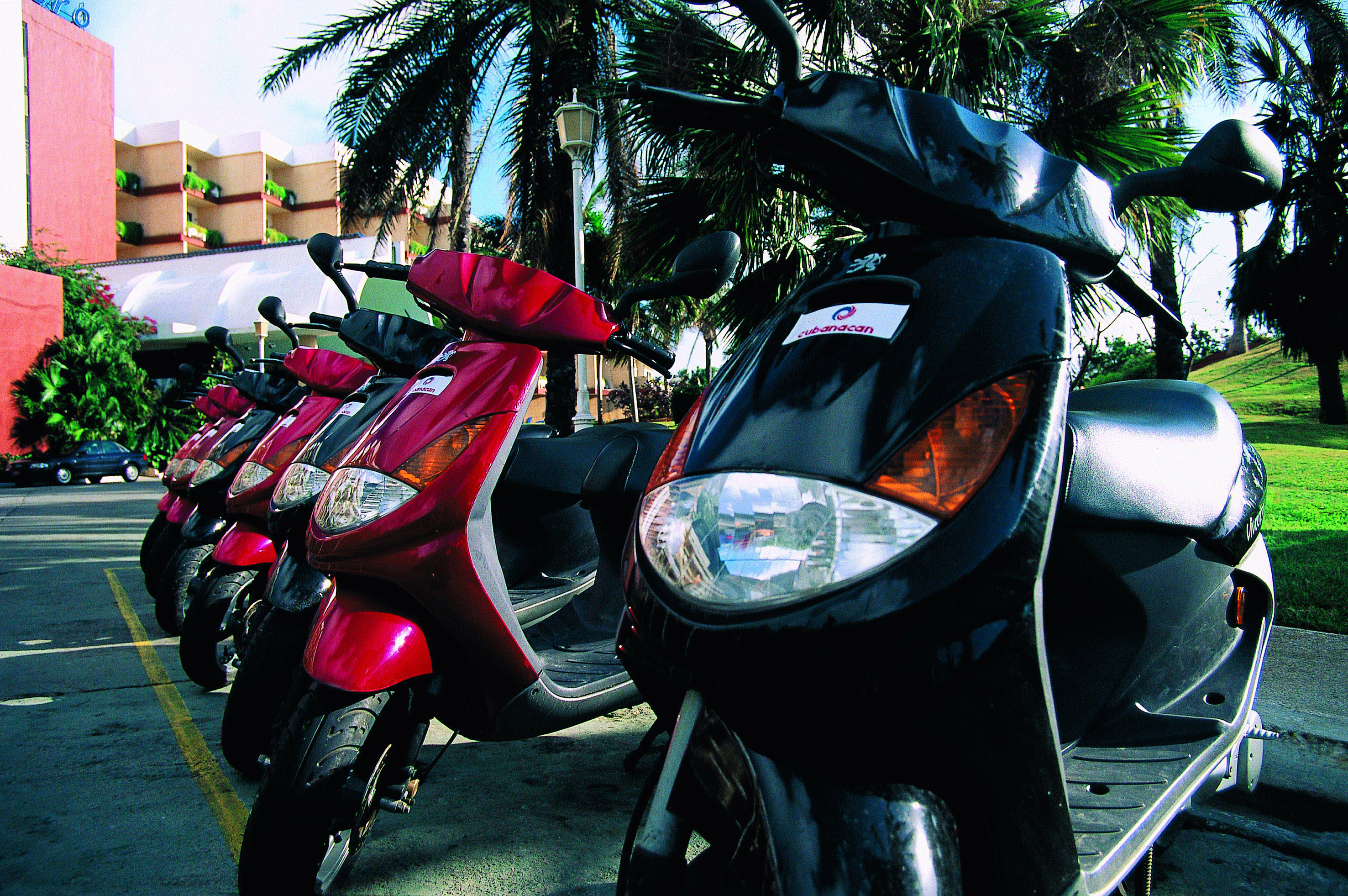a row of scooters parked in a row