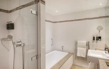 a bathroom with a shower and bathtub
