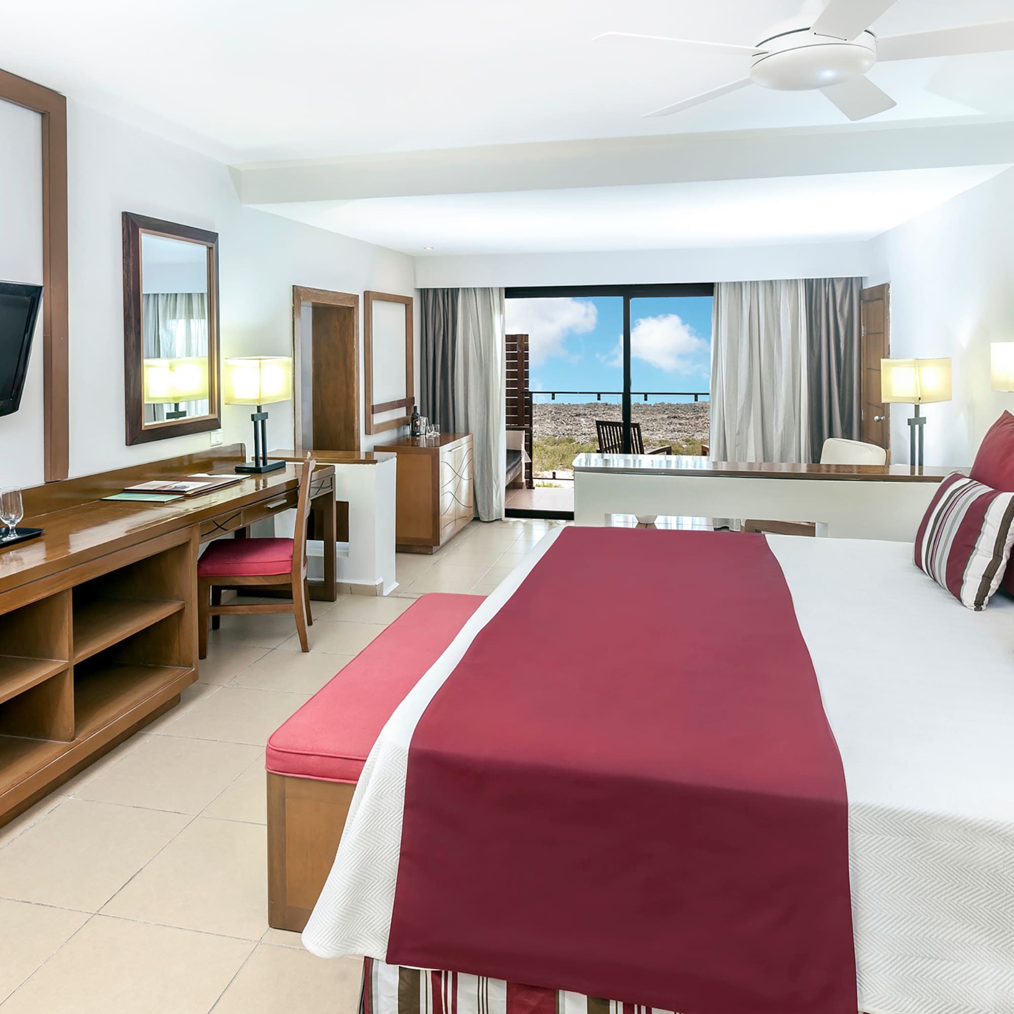 a room with a bed and a television