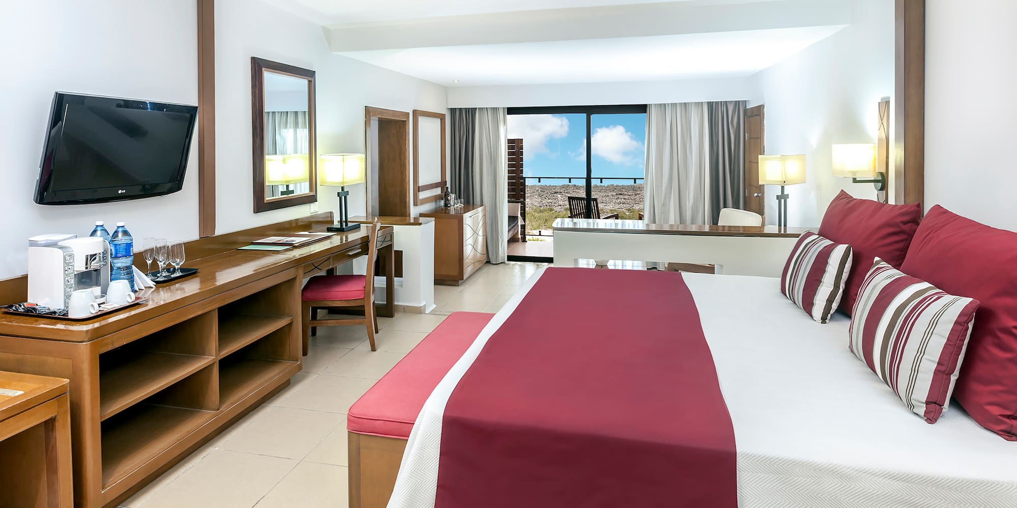 a room with a bed and a television