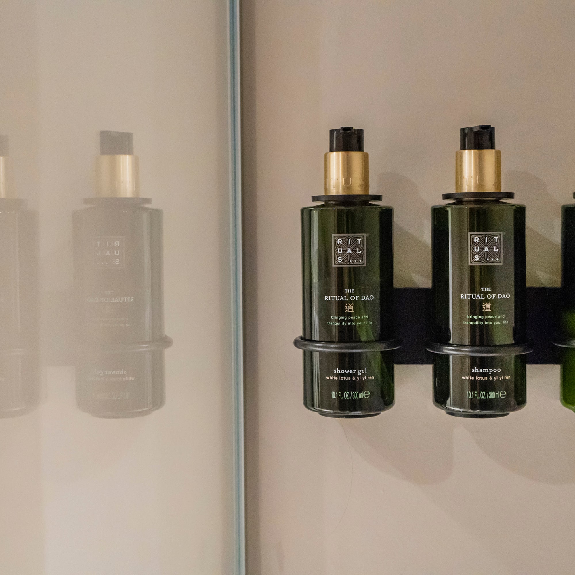 a group of green bottles on a wall