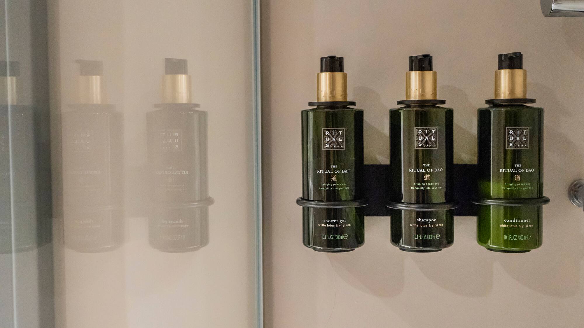 a group of green bottles on a wall