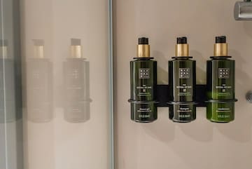 a group of green bottles on a wall