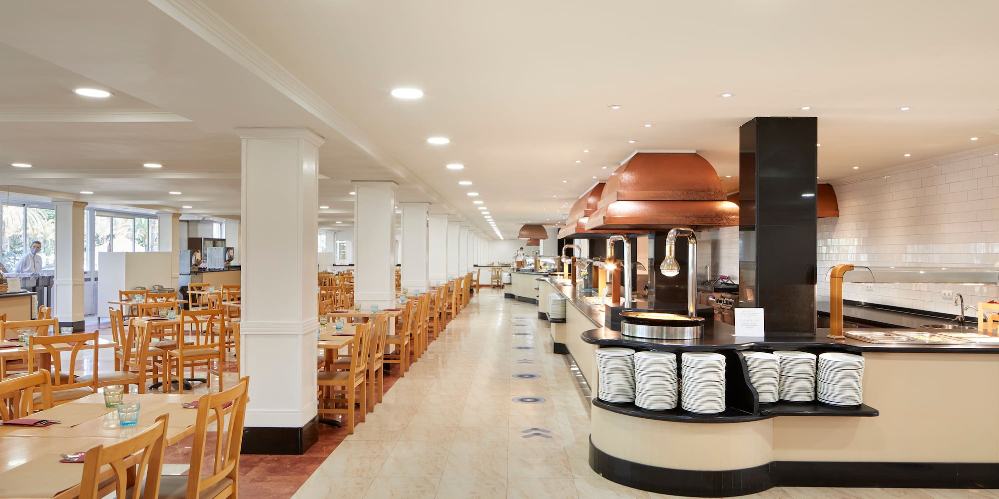 a restaurant with tables and chairs