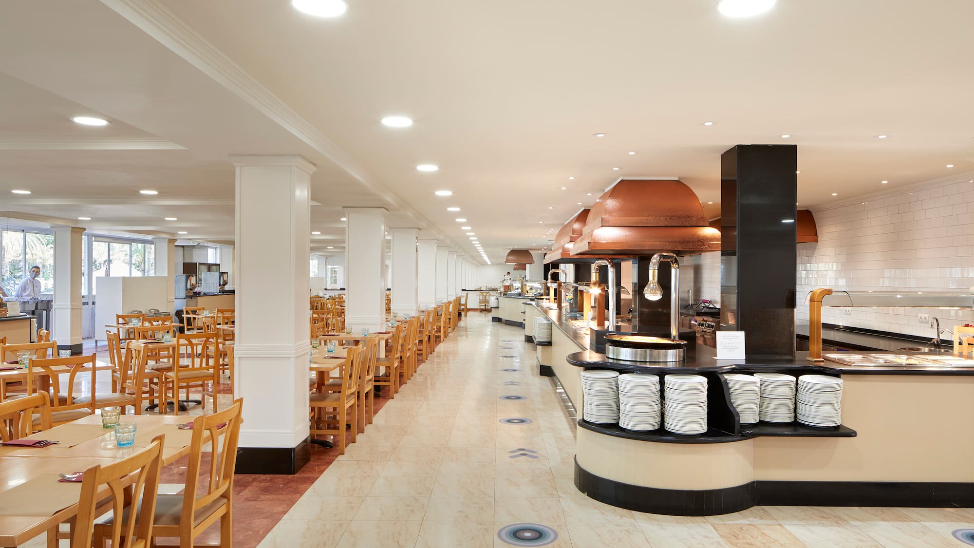 a restaurant with tables and chairs