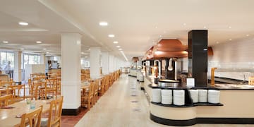 a restaurant with tables and chairs