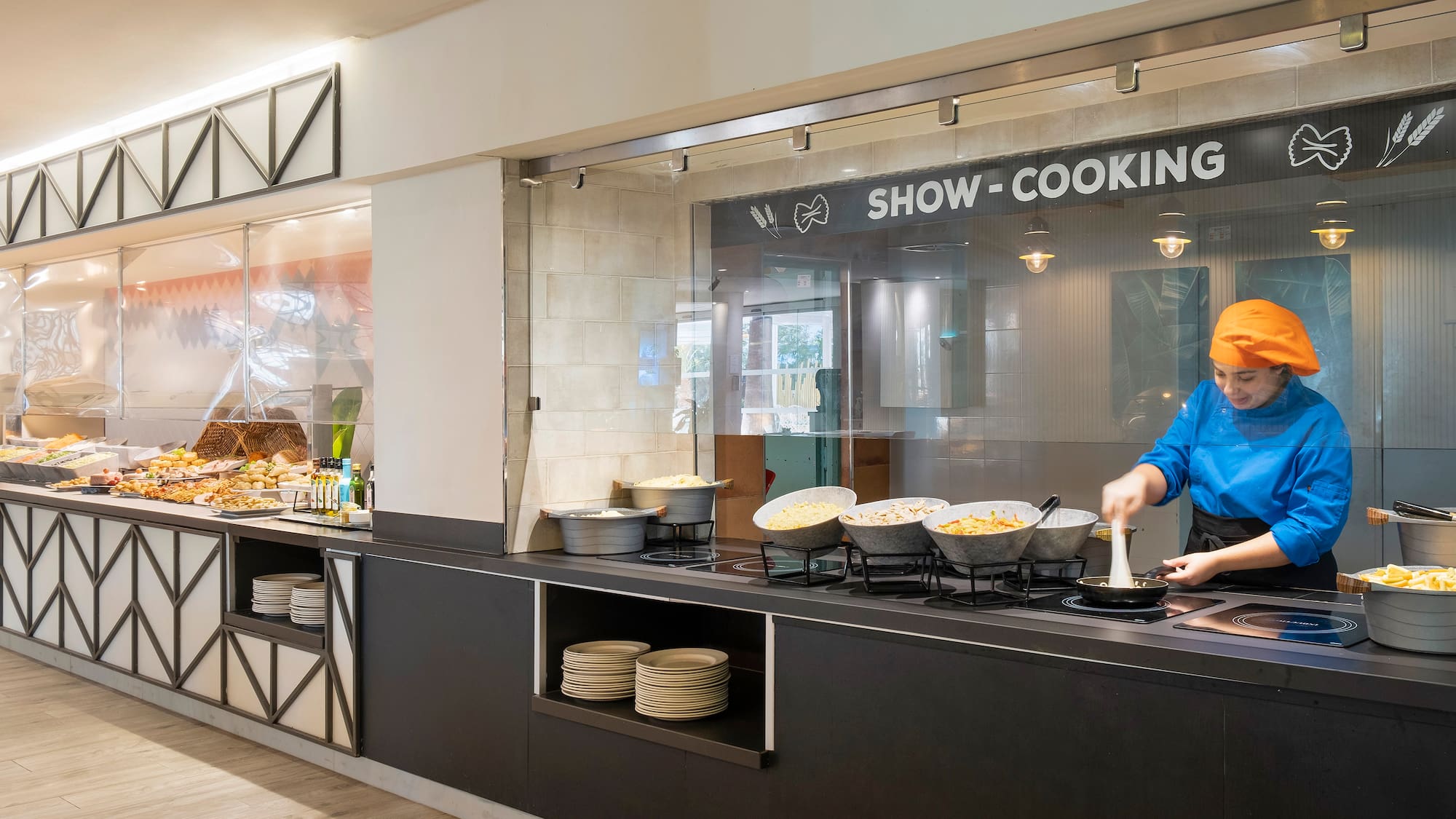 a person cooking food in a kitchen