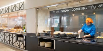 a person cooking food in a kitchen