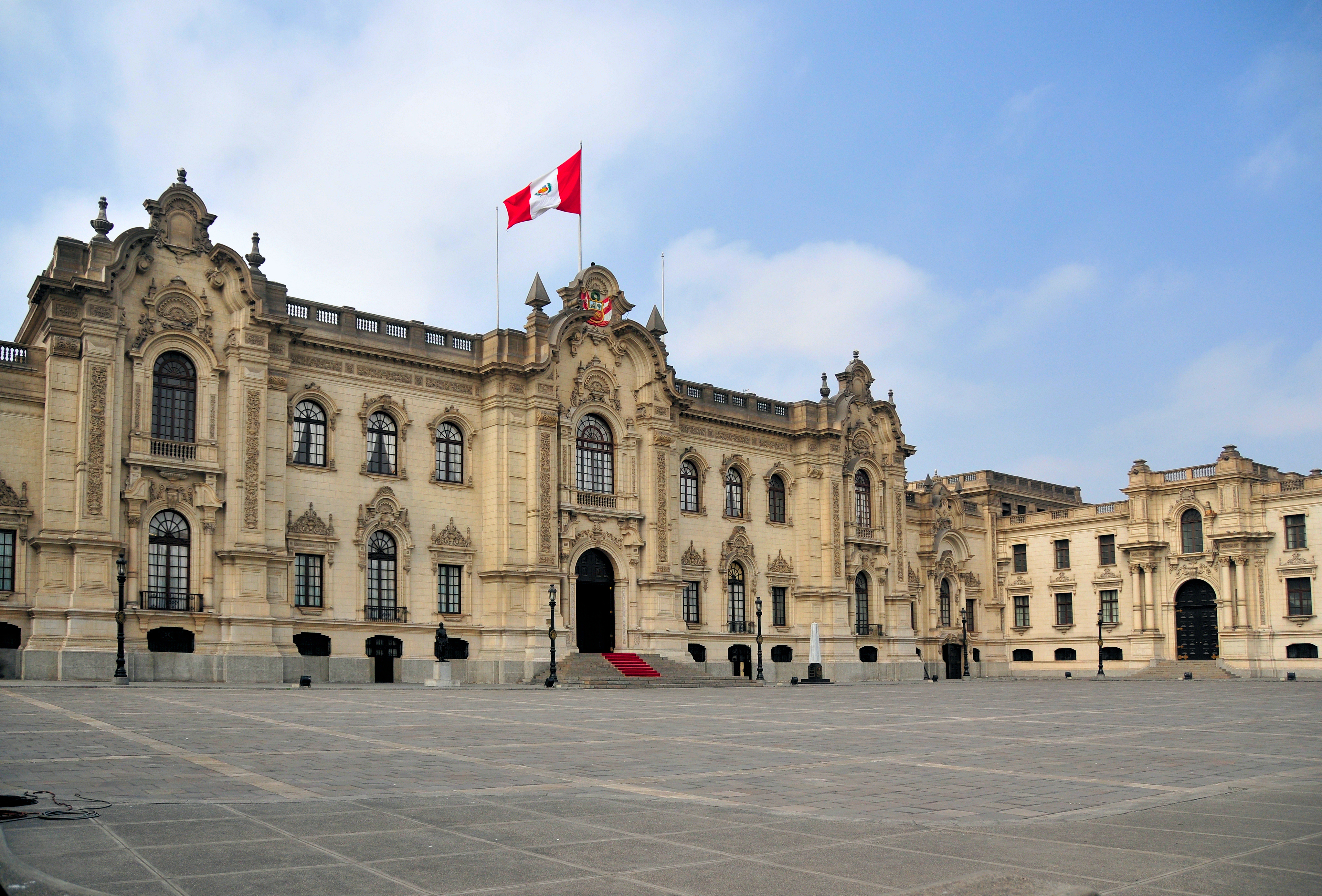 a large building with a flag on top