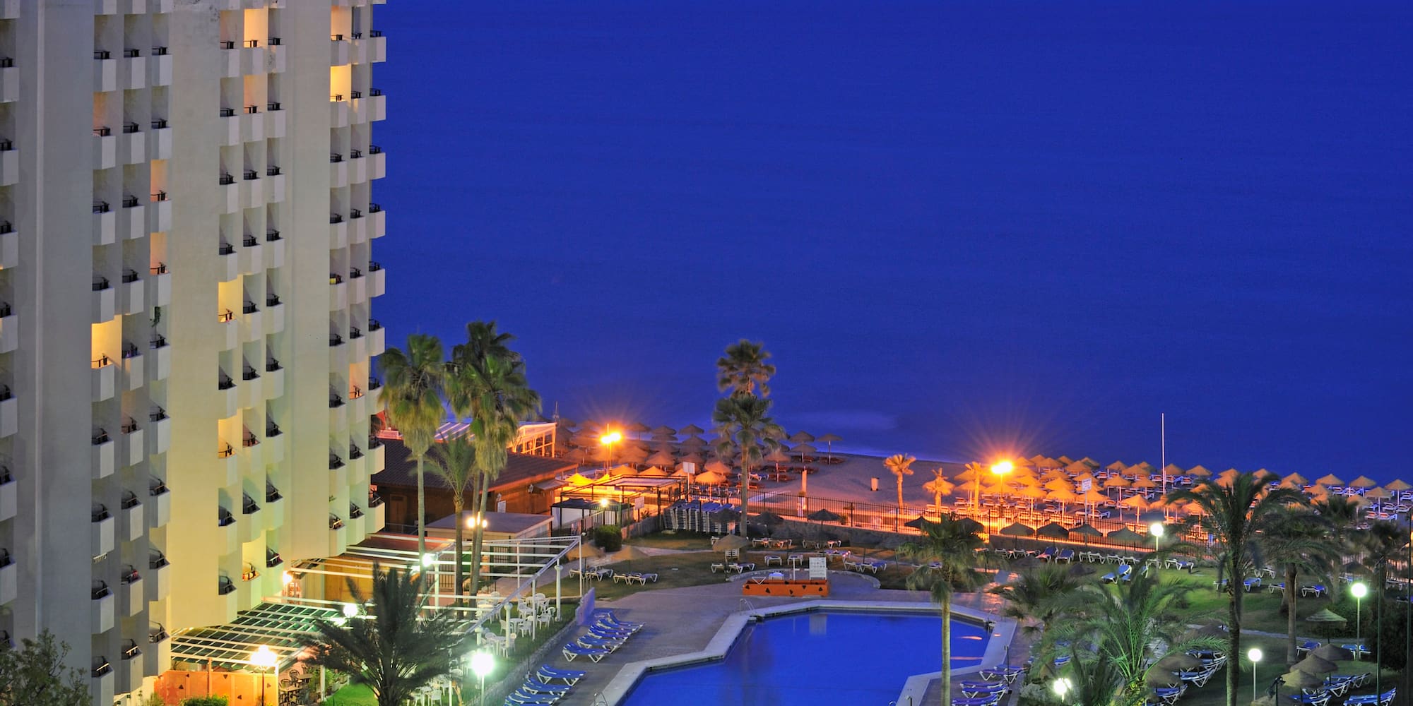 a swimming pool next to a building