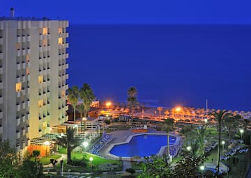 a swimming pool next to a building