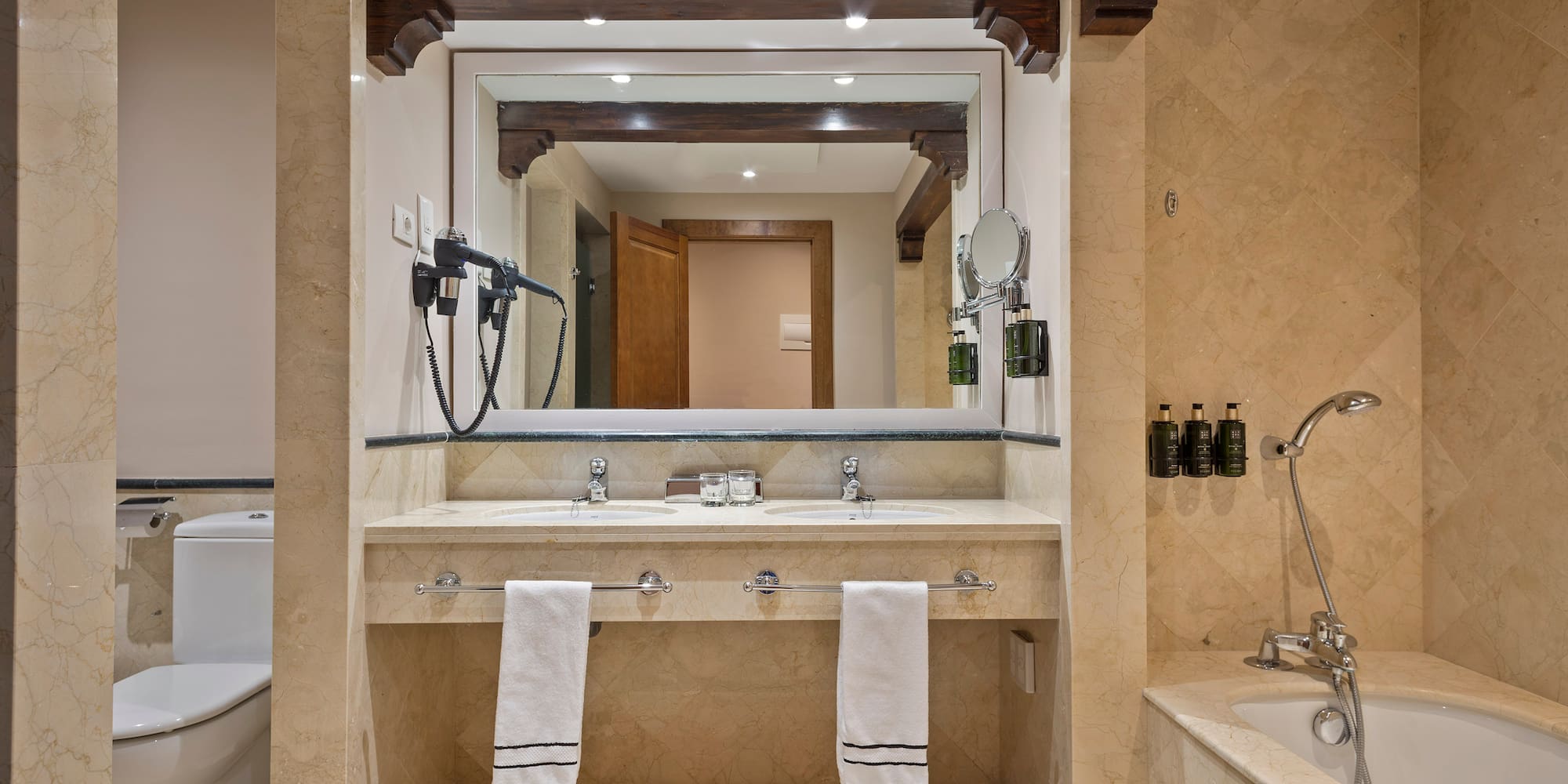 a bathroom with a large mirror and a bathtub