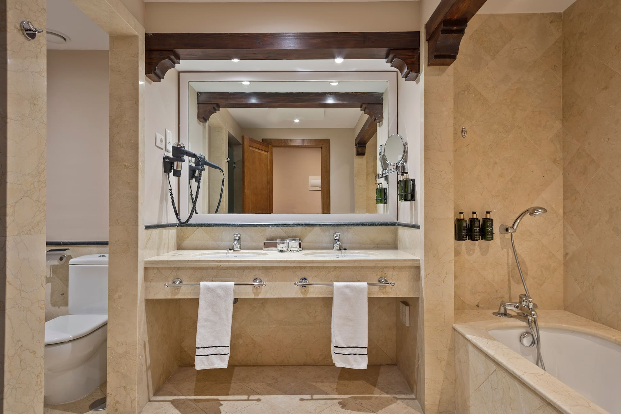 a bathroom with a large mirror and a bathtub