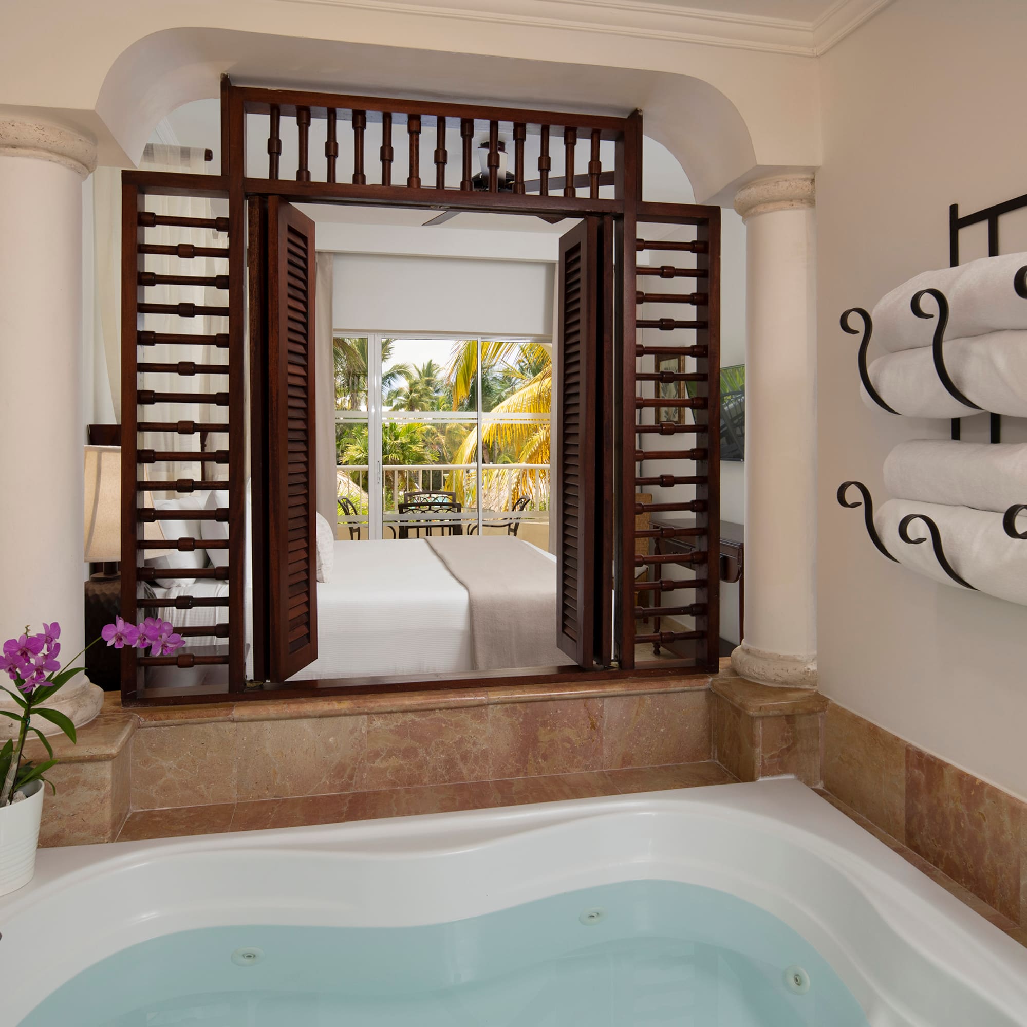 a bathtub with towels in a room