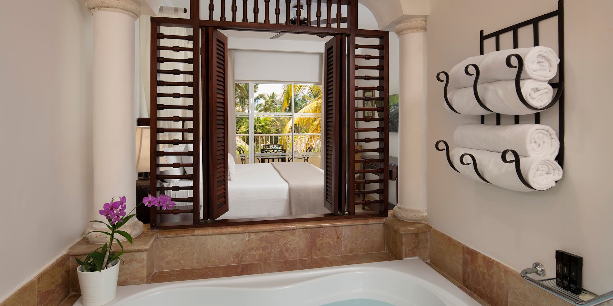 a bathtub with towels in a room