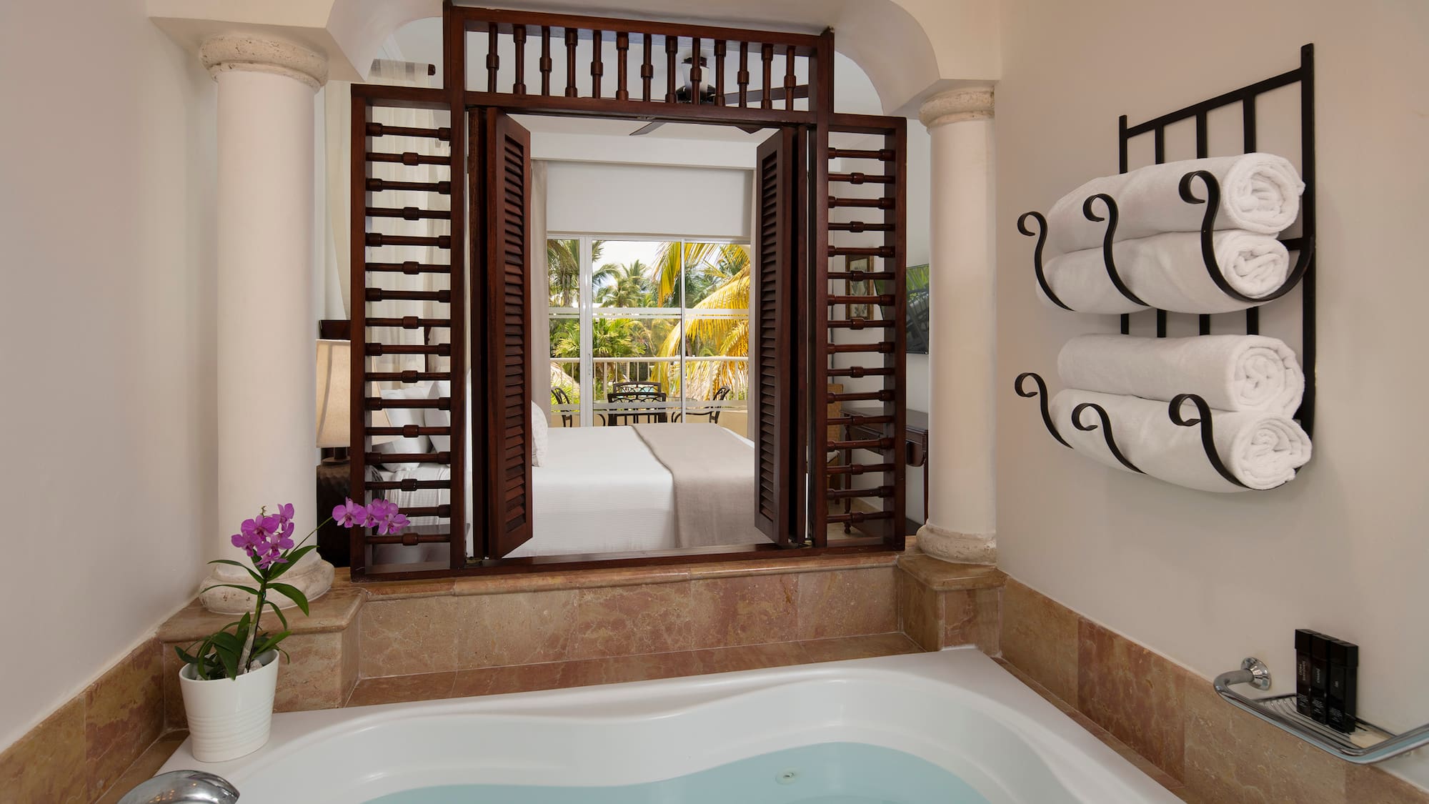 a bathtub with towels in a room