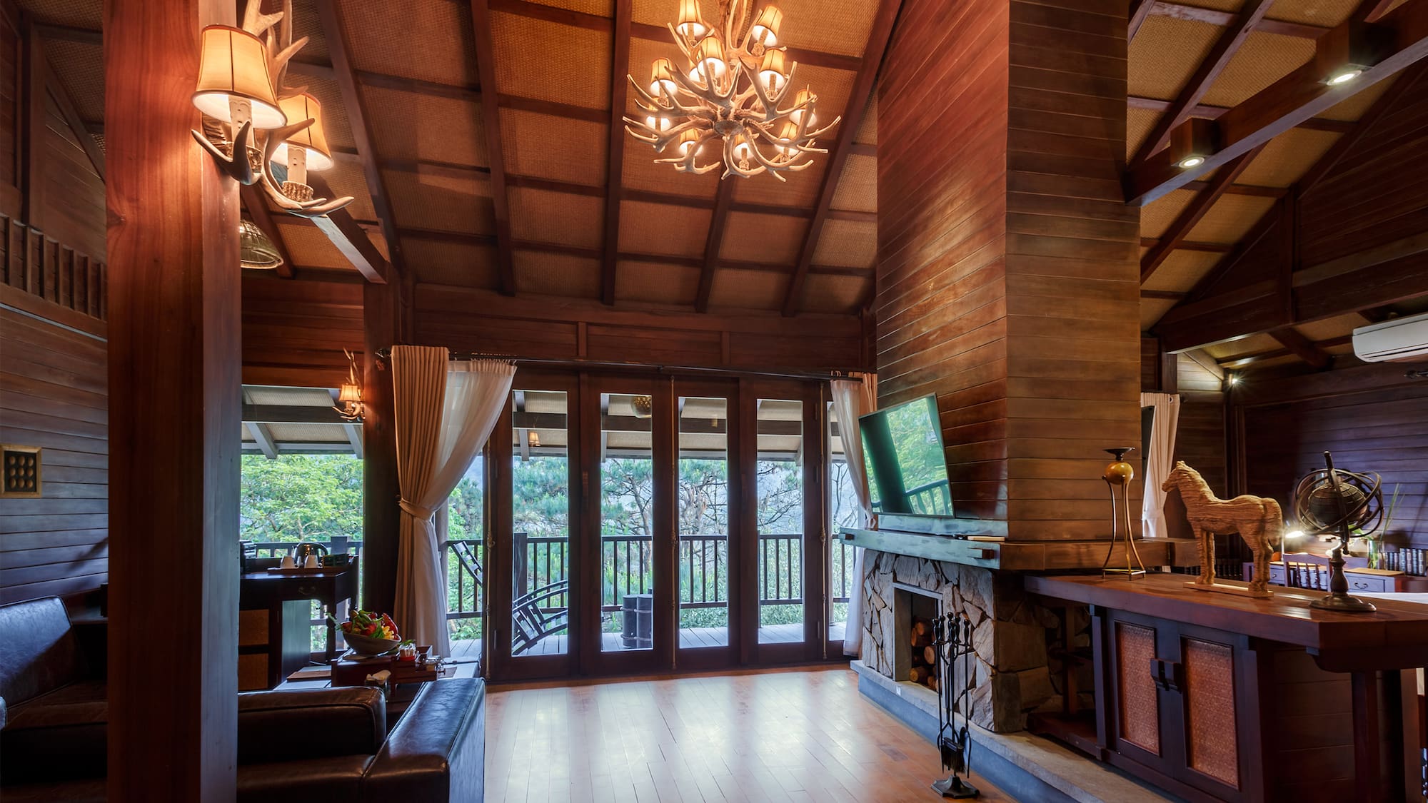 a room with a television and a fireplace