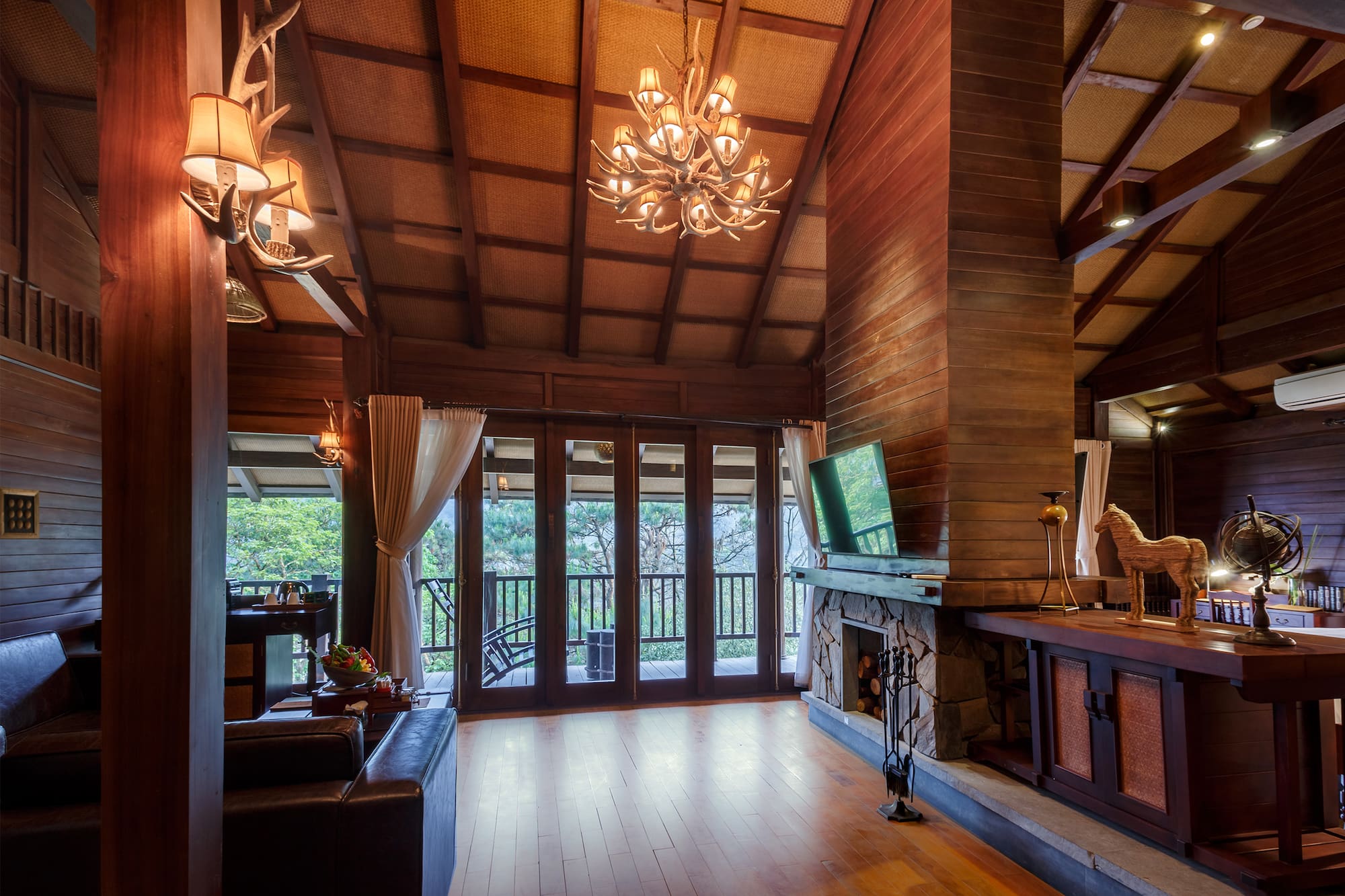 a room with a television and a fireplace