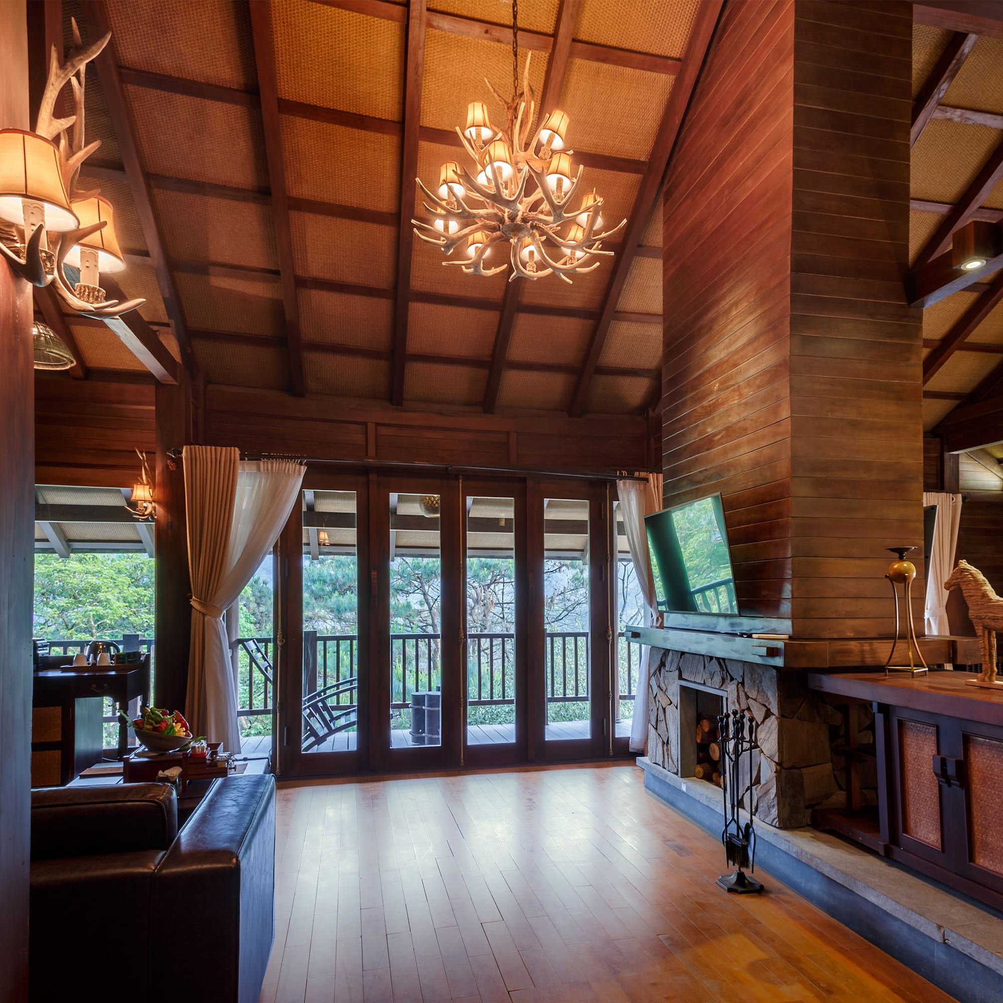 a room with a television and a fireplace